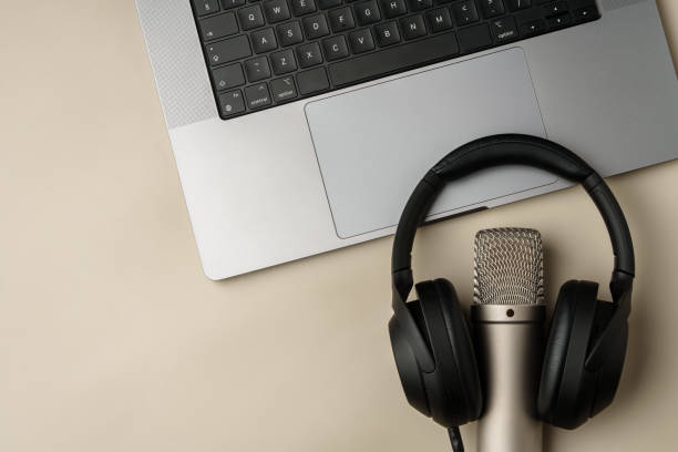 istock Headphones and microphone on the table close up 2039500306