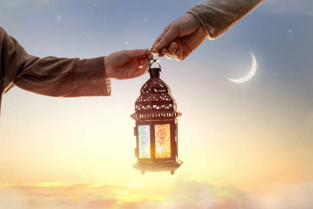 Ornamental Arabic lantern with burning candle stock photo