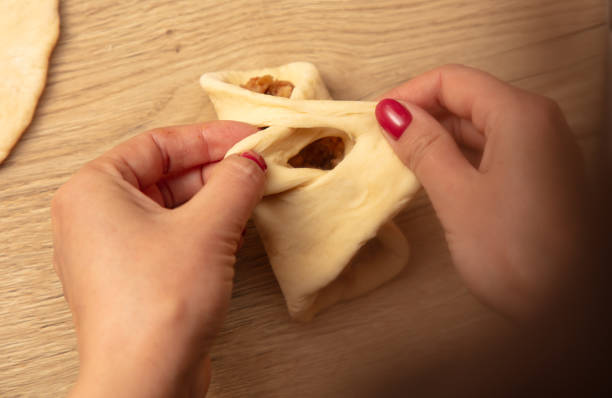 istock Woman preparing buns with jam from doug 2039507563