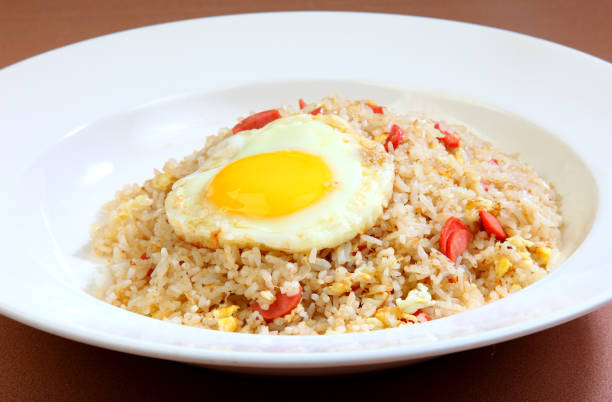 istock delicious ham chicken, egg, fried rice in white plate on brown background premium western cafe halal food menu for restaurant 2039508609