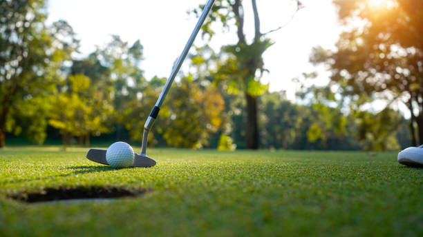 istock Golfer playing golf in the evening golf course, on sun set evening time. 2039534306