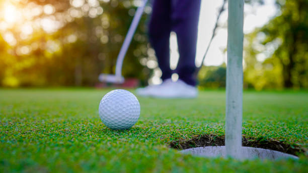 istock Golfer playing golf in the evening golf course, on sun set evening time. 2039534321