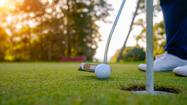 istock Golfer playing golf in the evening golf course, on sun set evening time. 2039534323