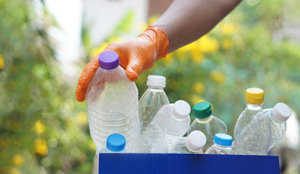 istock Hand holds used plastic bottle to put in junk bin for recycling. Concept, sorting garbage campaign before throw away 2039534857
