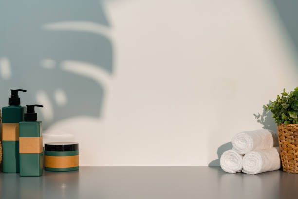 istock Soap dispenser and spa towels on white background in shadow 2039535902