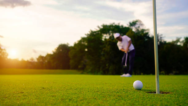 istock Golfer playing golf in the evening golf course, on sun set evening time. 2039536970