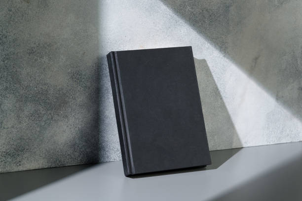 istock Black notepad with hard cover on gray background 2039549017