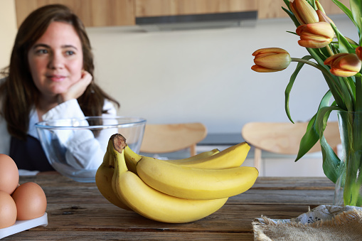 Young lady preparing to make a Banana Cake