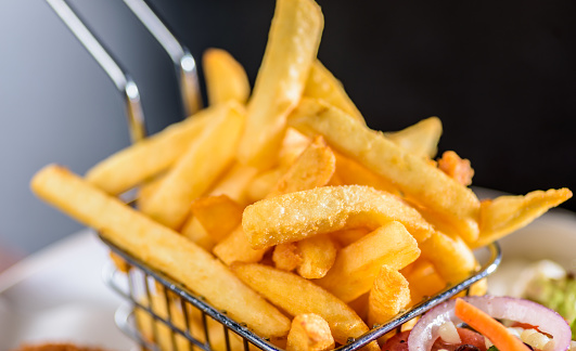 French Fries are also known as chips in some countries, made from potato and deep-fried in hot oil.