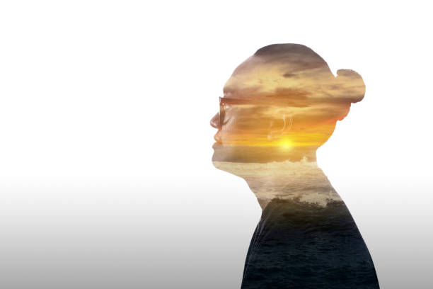 istock Double exposure image of a young man and sunset over the ocean 2039570420