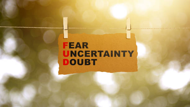 istock Paper hanging on the rope with 'Fear Uncertainty Doubt' text 2039575302