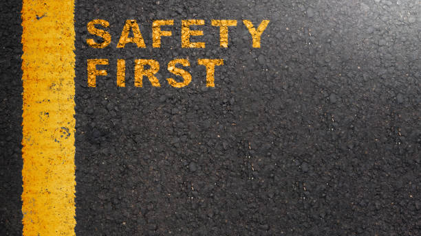 istock 'Safety first' text on the asphalt road 2039580551