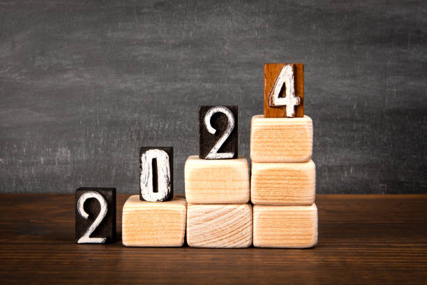 istock 2024 development and success Concept. Stairs from blocks on a wooden texture background 2039583174
