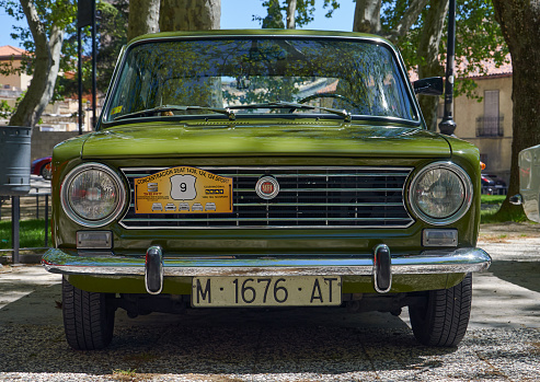 25-05-2013 Brihuega, Spain - A classic SEAT 124 showcased at a vintage car gathering, highlighting its timeless frontal design