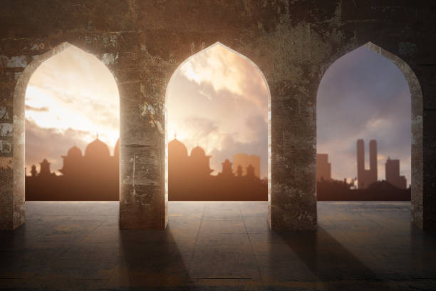 istock Arched mosque window with a view of a silhouette of the mosque with a dramatic sky view 2039586821