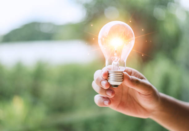 istock A light bulb is full of ideas and creativity New things to develop innovation, brainstorming and imagination, leading to effective learning. a man's hand holding Light bulb with and space for text. 2039589411