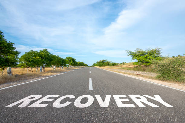 istock 'Recovery' text on the asphalt road 2039592862