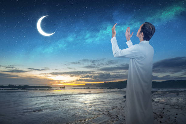 istock Muslim man raised her hands and prayed to Allah 2039597315