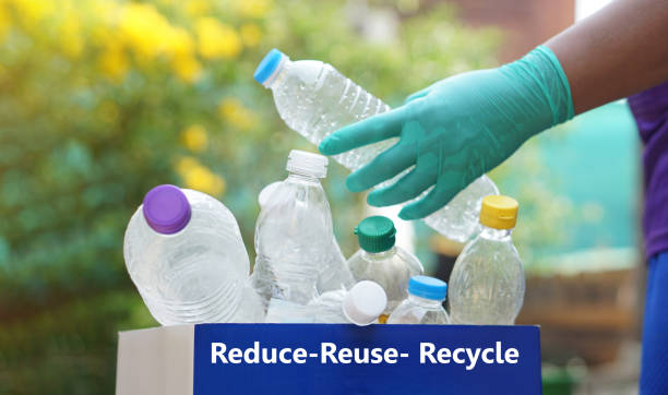 istock Hand holds plastic bottle to put in junk bin for recycling. Concept, sorting garbage campaign before throw away for reuse or recycle. Environment conservation. Eco friendly activity. 2039658310