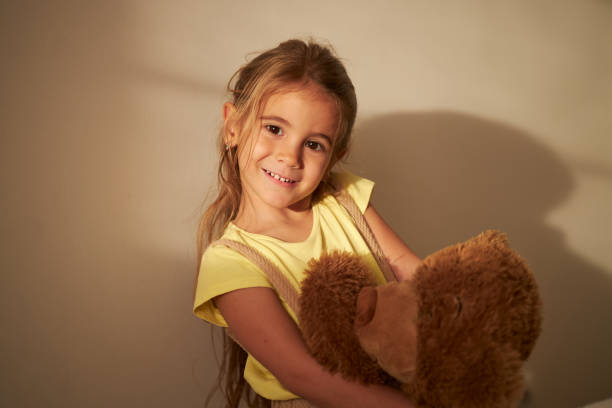 istock Beautiful girl hugging her Teddy Bear 2039676156