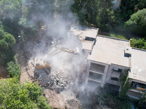 istock Excavator demolishing barracks for a new construction project. Aerial view. 2039687660