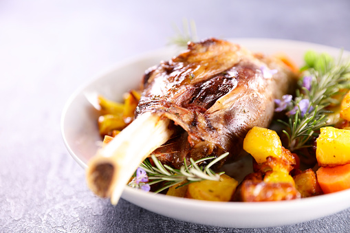 baked lamb leg with potatoes and carrots