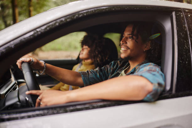 istock Happy black couple going on a trip by car. 2039695152