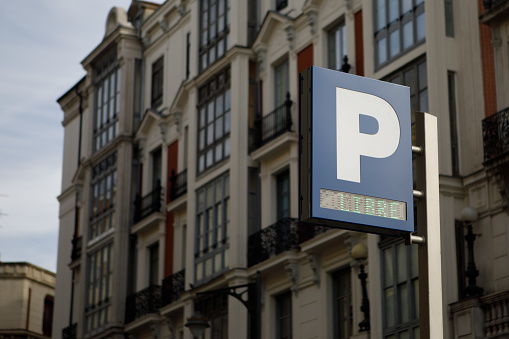 free public parking sign for cars and motorcycles in a city