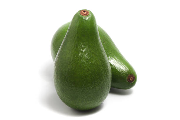 istock Two whole fresh organic avocado delicious fruit side view isolated on white background clipping path 2039703793