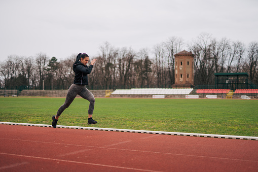 Image of a young athlete out running on the track.