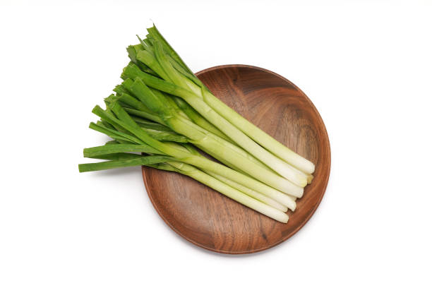 Green onions close-up on white background stock photo