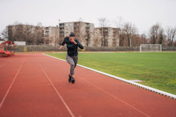 istock A young athlete is training. She runs on the athletics track. 2039735837