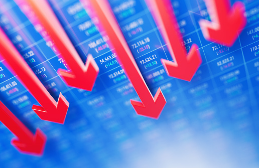 Red arrows moving down over stock market data background. Horizontal composition with copy space. Volatility in Global Stock Markets.