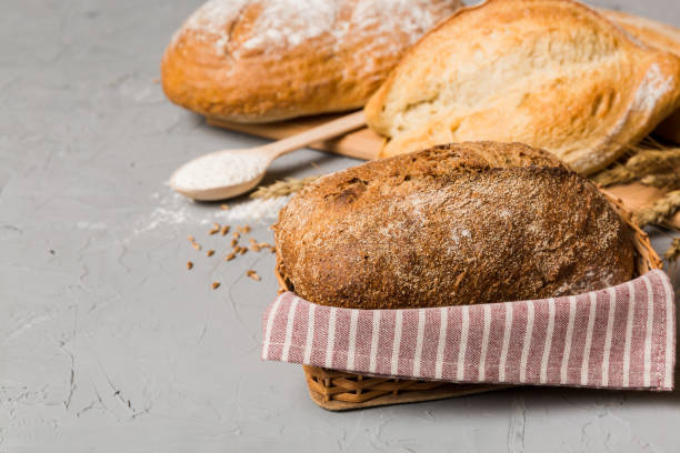 istock Homemade natural breads. Different kinds of fresh bread as background, perspective view with copy space 2039751707