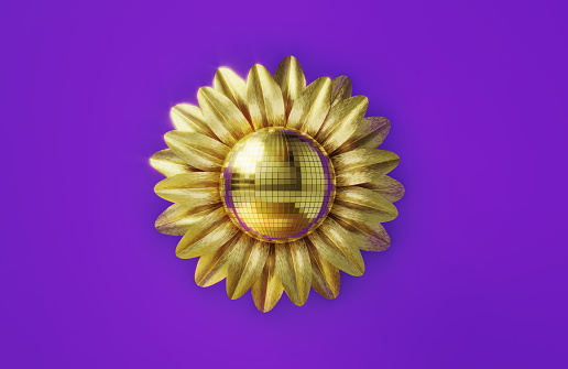 Golden disco ball and daisy on ultraviolet background. Horizontal composition.