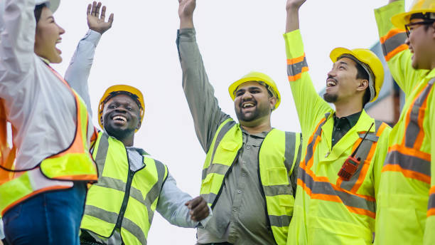 istock Professional dock workers posing cheerfully as a team. Thailand, Bangkok 2039773575