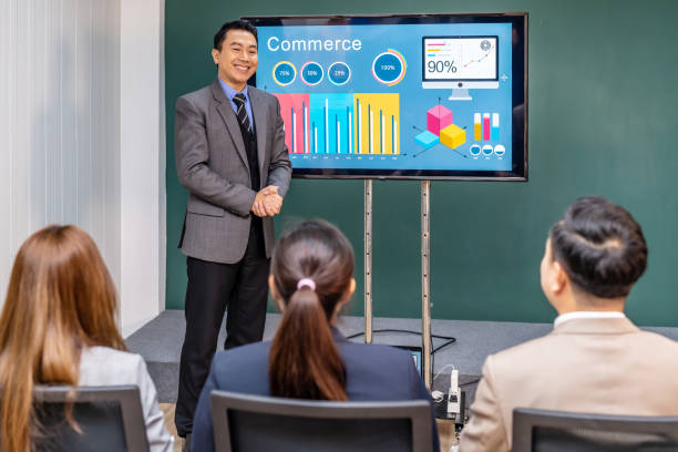 istock Man presenting in front of an audience in an office setting 2039774705