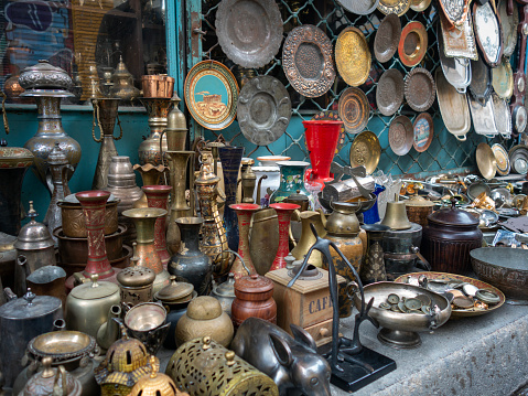 An old gramophone and other antique objects at antiques market in street