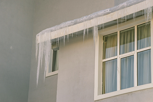 View of icicles shaped down from the roof beam.