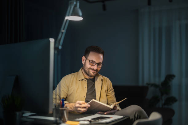 istock Portrait of a smiling man working at home on some new project 2039852688