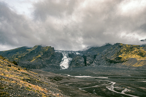 View on the Eyjafjöll glacier from Þórsmörk in Iceland during a cloudy summer day.
