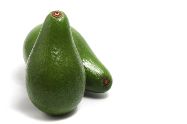istock Two whole fresh organic avocado delicious fruit side view isolated on white background clipping path 2039862953