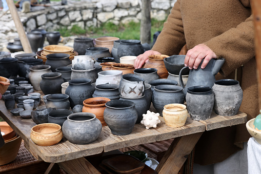 Cracow, Poland - April 11, 2023: Handmade imitations of medieval ceramic vessels in knight camp at the festival of historical reconstruction