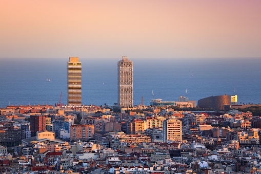 Barcelona cityscape with Poblenou district and Mediterranean Sea in background. Sunset city view of Barcelona, Spain.