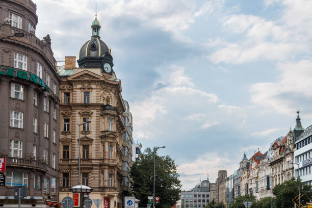 Neo-renaissance style building at Wenceslas Square, green copper dome with clock, Prague, Czech Republic