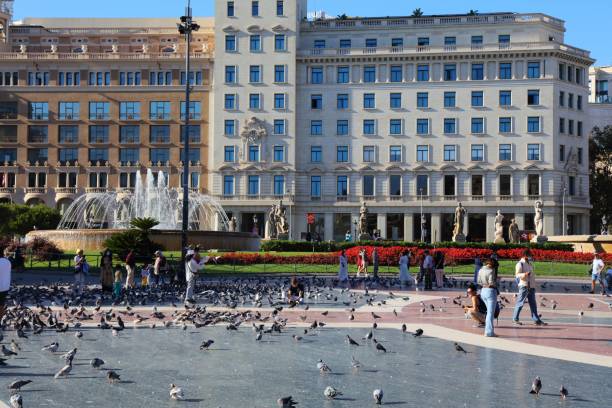 People visit Placa de Catalunya public square in Barcelona, Spain. Barcelona is the 2nd largest city in Spain.