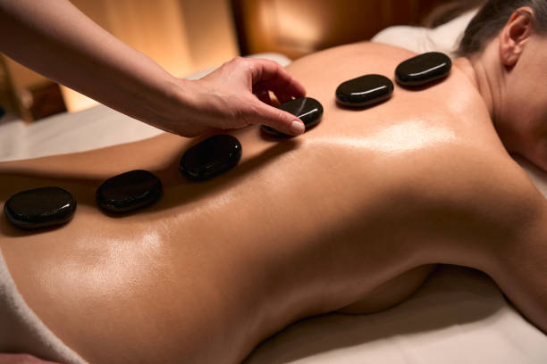istock Qualified massotherapist giving relaxing massage to female client 2039938938