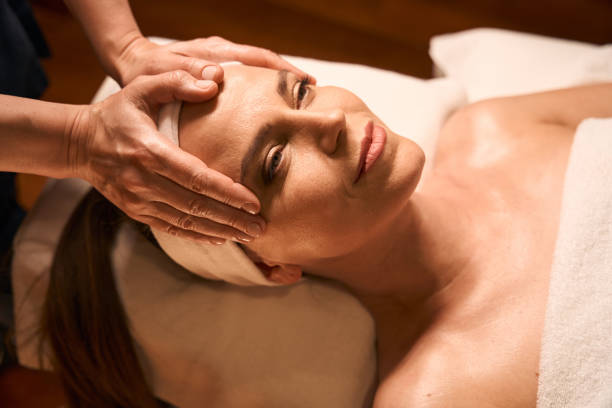 istock Acupressure practitioner hands stimulating reflex point on female face 2039939496