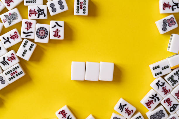 istock mahjong tiles on yellow background 2039948094