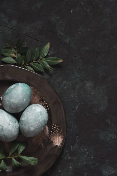 istock Natural dyed blue Easter eggs on dark gray background. Top view point. Easter celebration concept. 2039968282